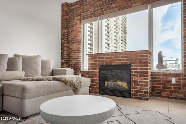 2302 N Central Ave Unit 206, Phoenix, AZ 85004 - living area featuring tile patterned flooring, a fireplace, and brick wall