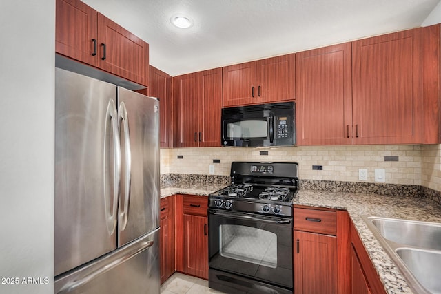 2302 N Central Ave Unit 206, Phoenix, AZ 85004 - kitchen with black appliances, backsplash, light tile patterned floors, and light stone countertops