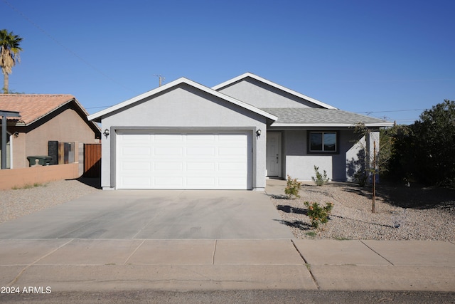 single story home featuring a garage