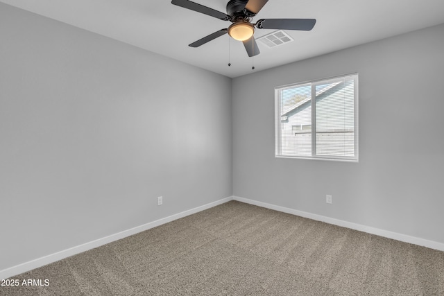 empty room featuring carpet and ceiling fan