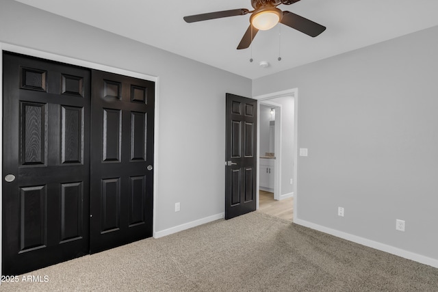 unfurnished bedroom with light colored carpet and ceiling fan