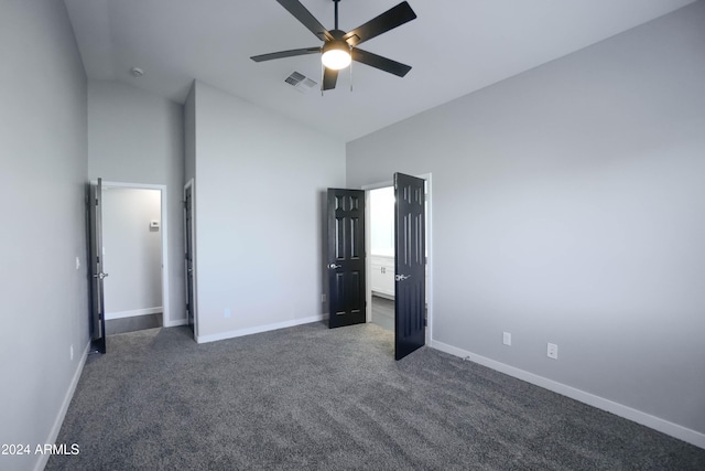 unfurnished bedroom featuring ceiling fan, high vaulted ceiling, and dark carpet