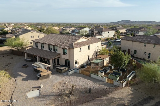 birds eye view of property featuring a mountain view and a residential view