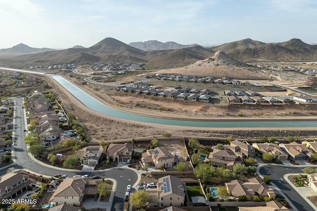 birds eye view of property with a mountain view and a residential view