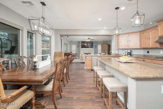 dining space featuring visible vents, recessed lighting, a ceiling fan, and dark wood-style flooring