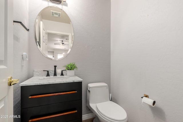 1925 W Olive Way, Chandler, AZ 85248 - bathroom with vanity, toilet, and a ceiling fan