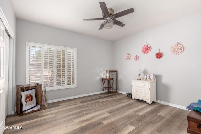 1925 W Olive Way, Chandler, AZ 85248 - bedroom with wood finished floors, a closet, baseboards, and ceiling fan
