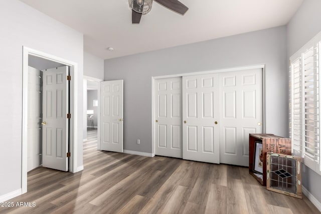 1925 W Olive Way, Chandler, AZ 85248 - unfurnished bedroom with wood finished floors, a closet, baseboards, and ceiling fan
