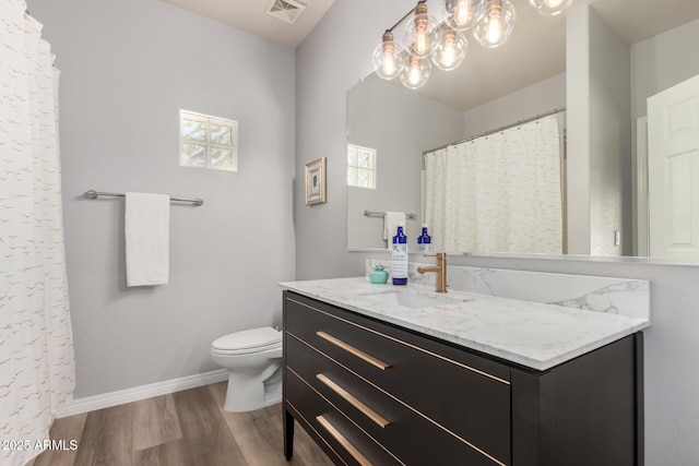 1925 W Olive Way, Chandler, AZ 85248 - full bathroom with wood finished floors, vanity, toilet, and baseboards