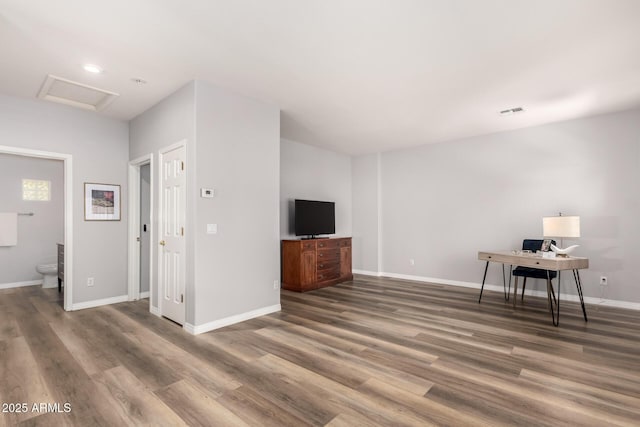 1925 W Olive Way, Chandler, AZ 85248 - unfurnished living room with attic access, wood finished floors, a desk, and baseboards