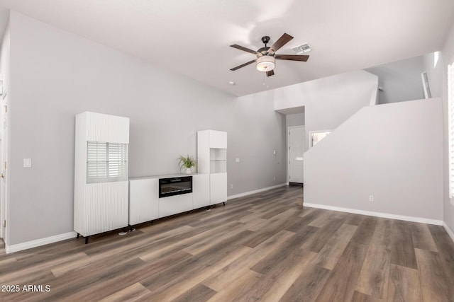 1925 W Olive Way, Chandler, AZ 85248 - unfurnished living room featuring ceiling fan, wood finished floors, and baseboards