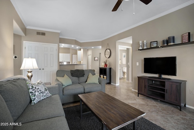 3236 E Chandler Blvd Unit 2018, Phoenix, AZ 85048 - living area featuring a ceiling fan, crown molding, and light tile patterned floors