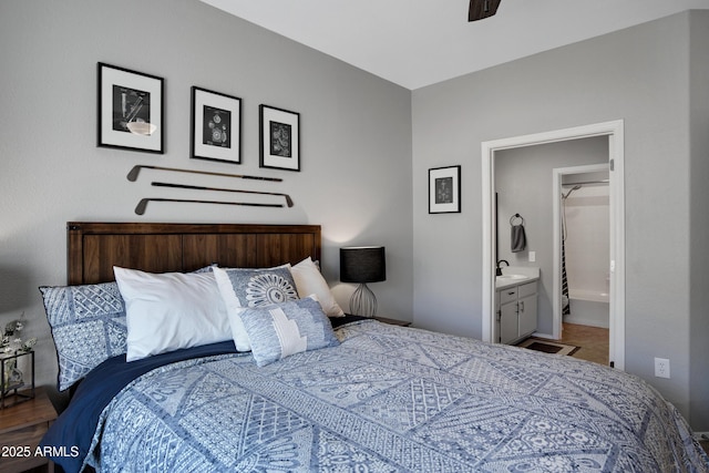 3236 E Chandler Blvd Unit 2018, Phoenix, AZ 85048 - bedroom featuring connected bathroom and a ceiling fan