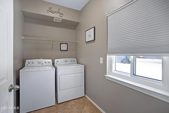 3236 E Chandler Blvd Unit 2018, Phoenix, AZ 85048 - laundry room with washing machine and clothes dryer and light tile patterned floors