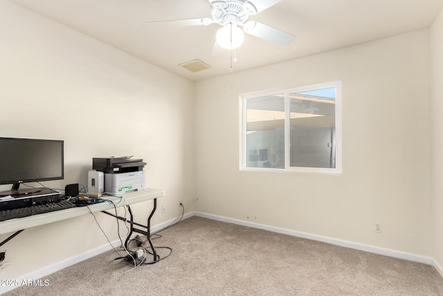 office area featuring a ceiling fan, carpet, visible vents, and baseboards