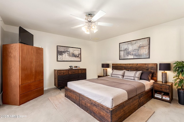 bedroom featuring light carpet and ceiling fan