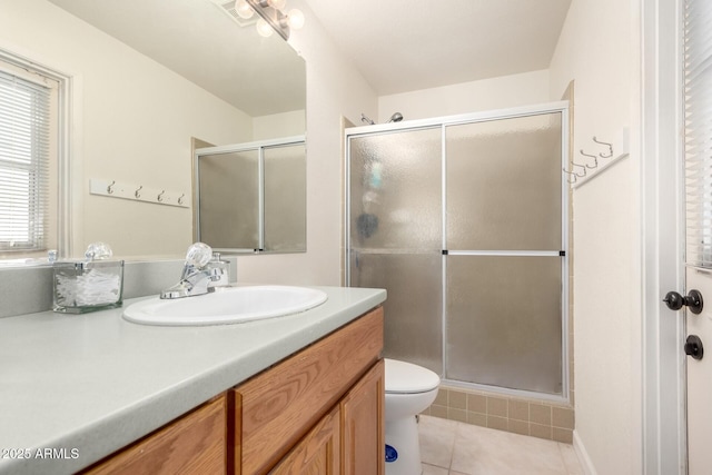 full bathroom featuring visible vents, a shower stall, vanity, and tile patterned floors