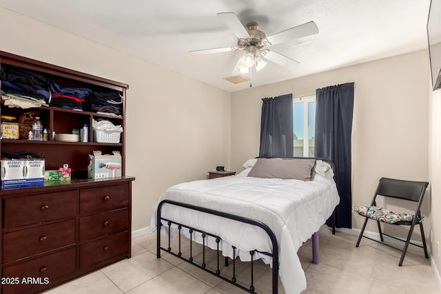 bedroom with a ceiling fan, visible vents, baseboards, and light tile patterned floors