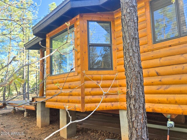 2028 Jones Pass, Overgaard, AZ 85933 - view of property exterior with log veneer siding