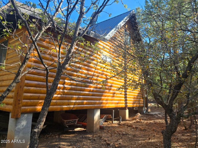 2028 Jones Pass, Overgaard, AZ 85933 - view of side of property with log veneer siding