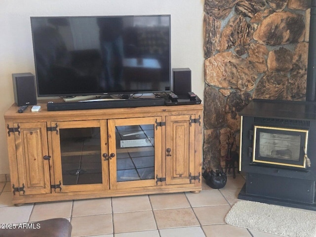 2028 Jones Pass, Overgaard, AZ 85933 - living area with light tile patterned floors and a wood stove