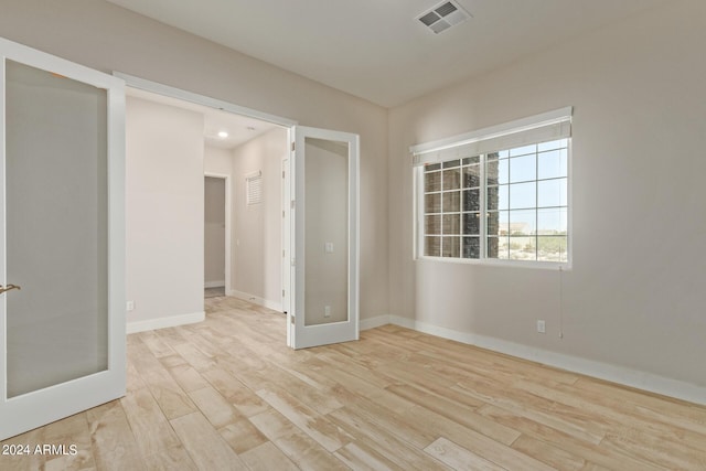 empty room with light wood-type flooring