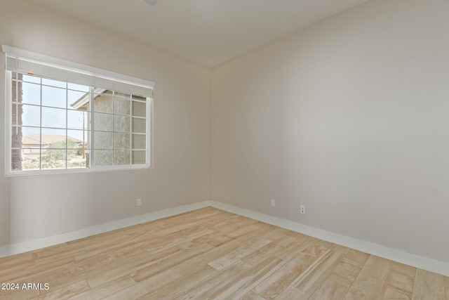 spare room with light hardwood / wood-style floors