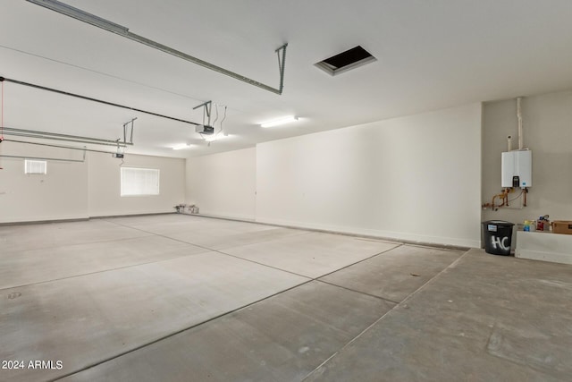 garage with water heater and a garage door opener