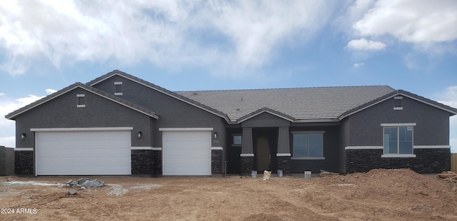 view of front of property with a garage