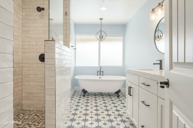 bathroom with vanity and shower with separate bathtub