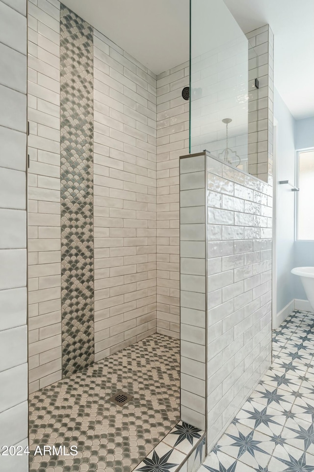 bathroom with tiled shower