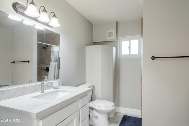 bathroom featuring tile patterned floors, walk in shower, vanity, and toilet