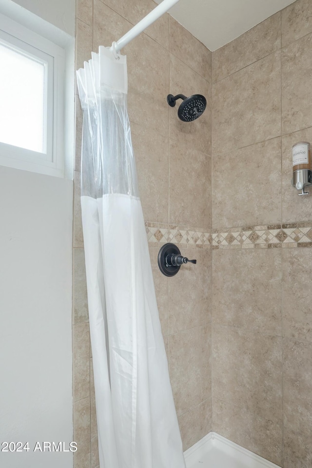 bathroom featuring a shower with curtain