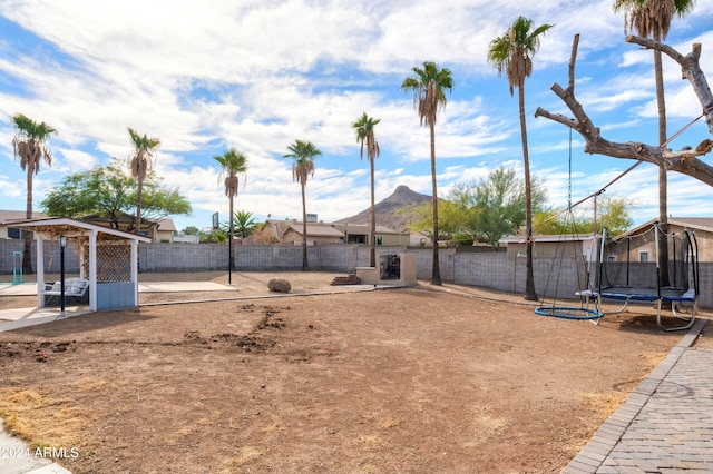 view of yard with a trampoline