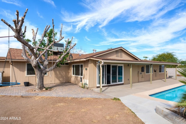 back of house with a patio area