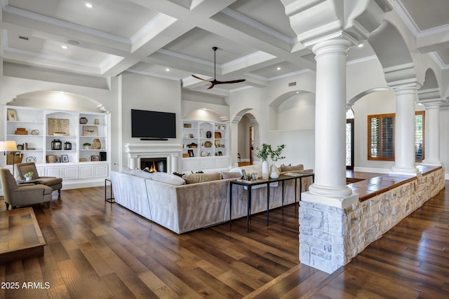2527 E Beechnut Ct, Chandler, AZ 85249 - living area featuring ornate columns, built in features, dark wood-style flooring, ceiling fan, and coffered ceiling