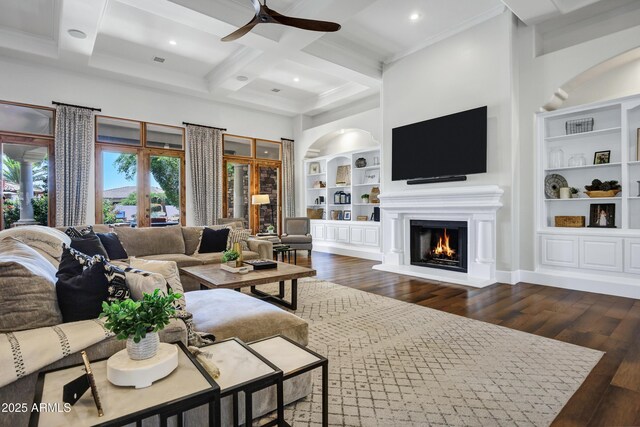 2527 E Beechnut Ct, Chandler, AZ 85249 - living room with built in shelves, ceiling fan, coffered ceiling, dark wood-type flooring, and arched walkways