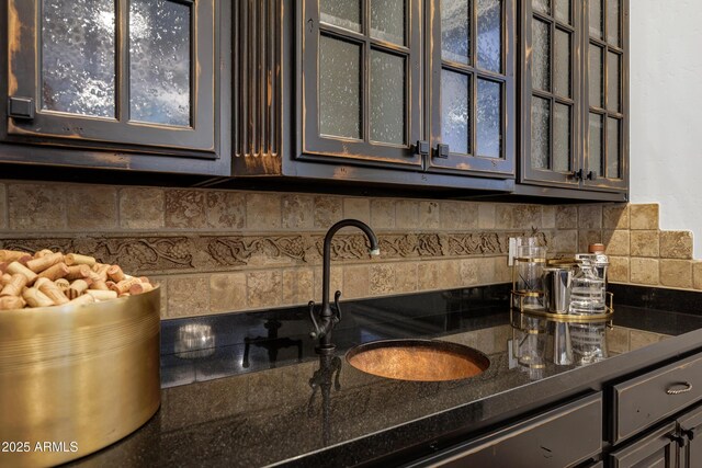 2527 E Beechnut Ct, Chandler, AZ 85249 - kitchen featuring tasteful backsplash, glass insert cabinets, and a sink