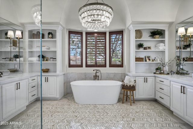 2527 E Beechnut Ct, Chandler, AZ 85249 - bathroom featuring a freestanding bath, a chandelier, vanity, and tile patterned floors