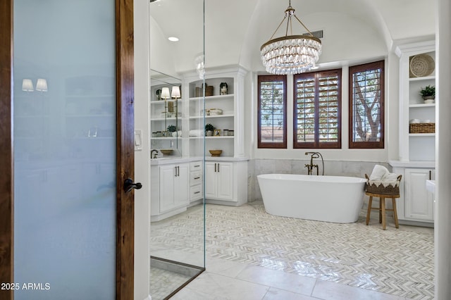 2527 E Beechnut Ct, Chandler, AZ 85249 - bathroom with a soaking tub, a chandelier, vanity, and tile patterned flooring
