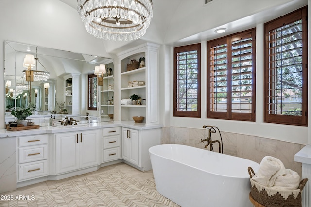 2527 E Beechnut Ct, Chandler, AZ 85249 - bathroom with a chandelier, a freestanding bath, vanity, and tile patterned flooring