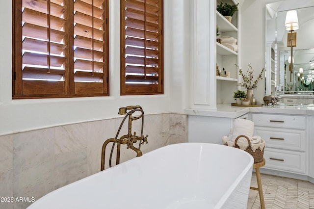 2527 E Beechnut Ct, Chandler, AZ 85249 - bathroom with a freestanding tub, tile walls, and a wainscoted wall