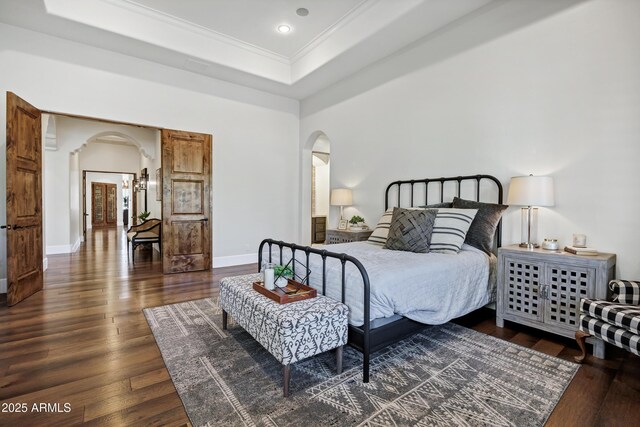 2527 E Beechnut Ct, Chandler, AZ 85249 - bedroom featuring arched walkways, ornamental molding, wood-type flooring, a raised ceiling, and recessed lighting
