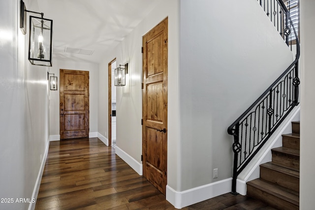 2527 E Beechnut Ct, Chandler, AZ 85249 - hallway featuring dark wood-style flooring, baseboards, and stairs