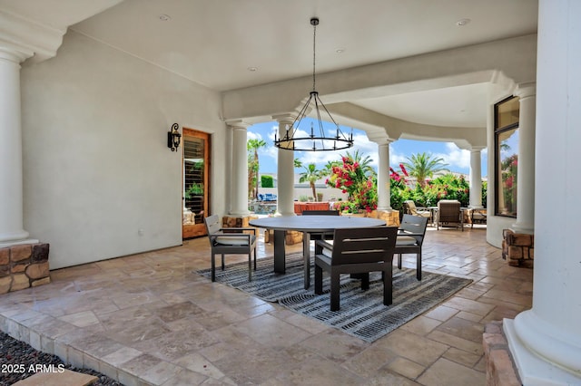 2527 E Beechnut Ct, Chandler, AZ 85249 - dining area with ornate columns, stone tile flooring, and a chandelier