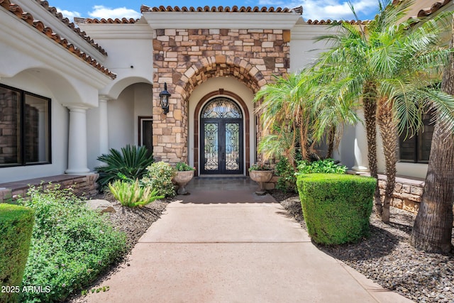 2527 E Beechnut Ct, Chandler, AZ 85249 - entrance to property with french doors, stucco siding, stone siding, and a tile roof