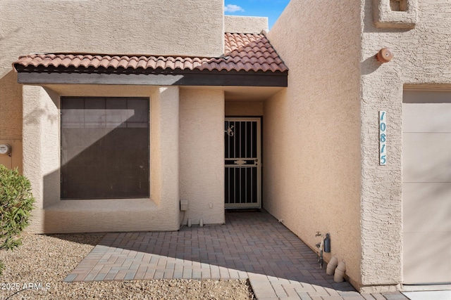 entrance to property with a patio area