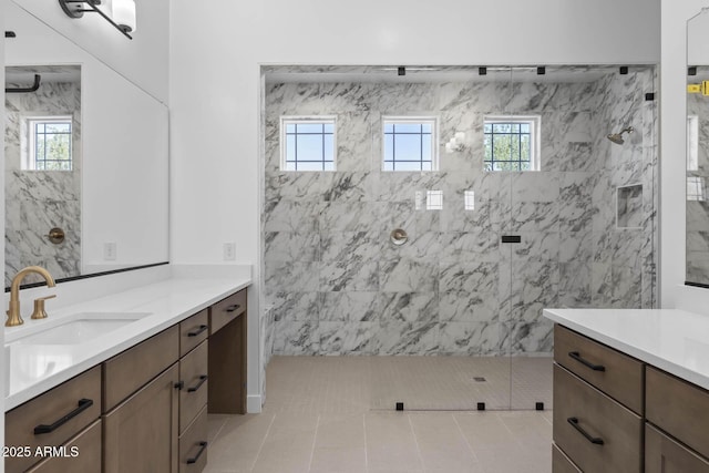 bathroom featuring vanity and a marble finish shower