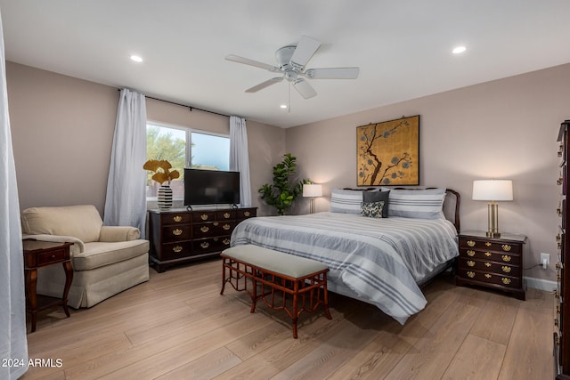 bedroom featuring light hardwood / wood-style floors and ceiling fan