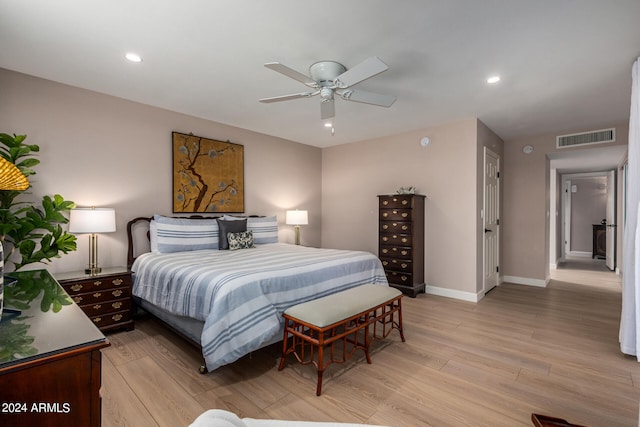 bedroom featuring light hardwood / wood-style floors and ceiling fan